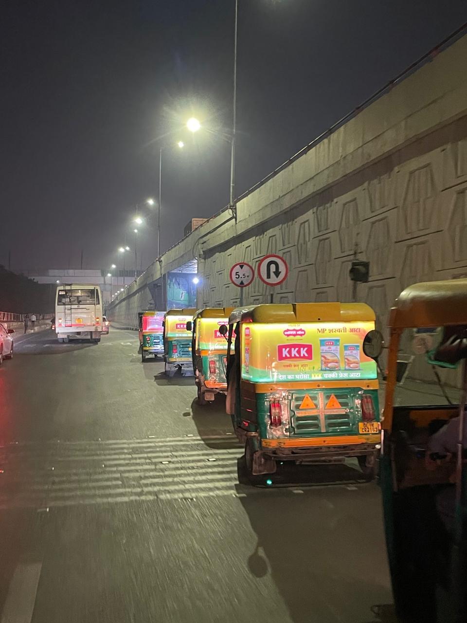 FireFlyR fleet convoy with backlit ads at night